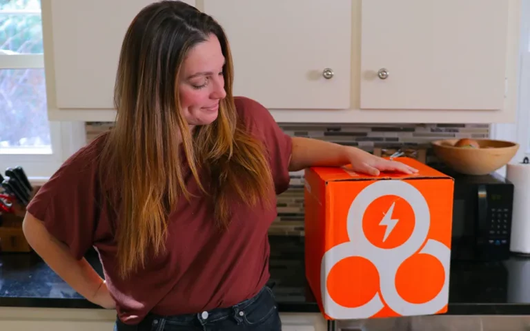 Emily Looking At Trifecta Nutrition Box